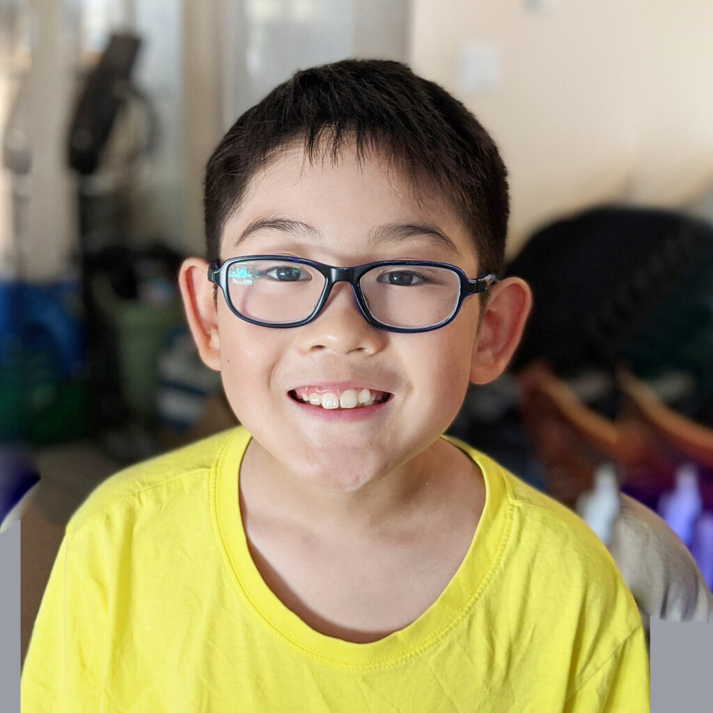 smiling child wearing glasses