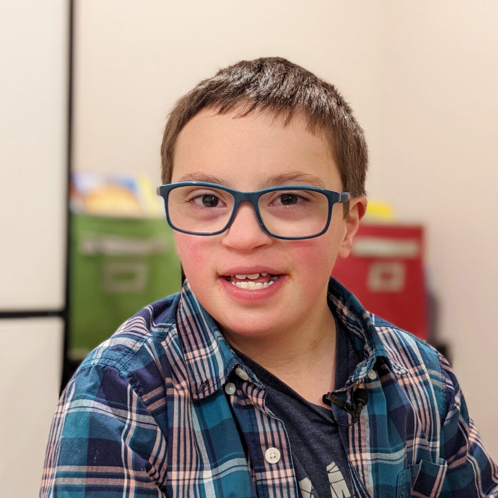 smiling child wearing glasses