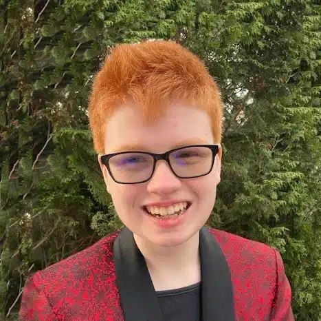 child wearing red tuxedo jaecket